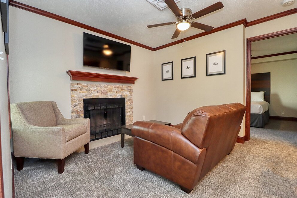 a living room with a fireplace and a couch