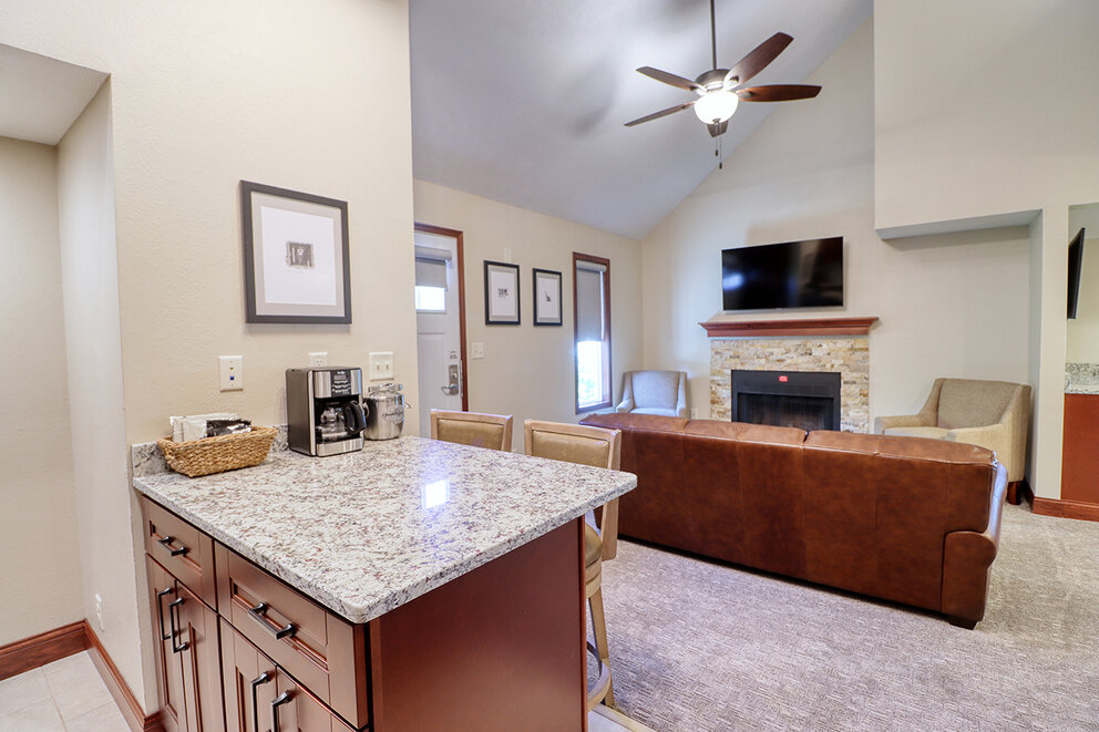 a kitchen with a fireplace and a television