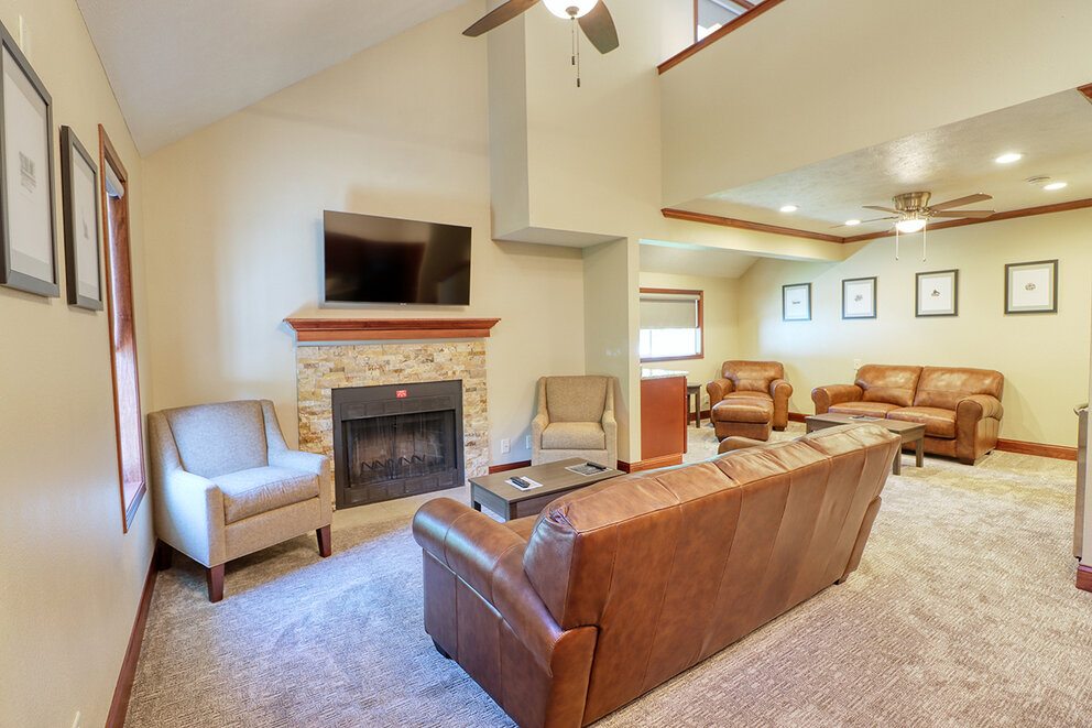 a living room with a fireplace and couches