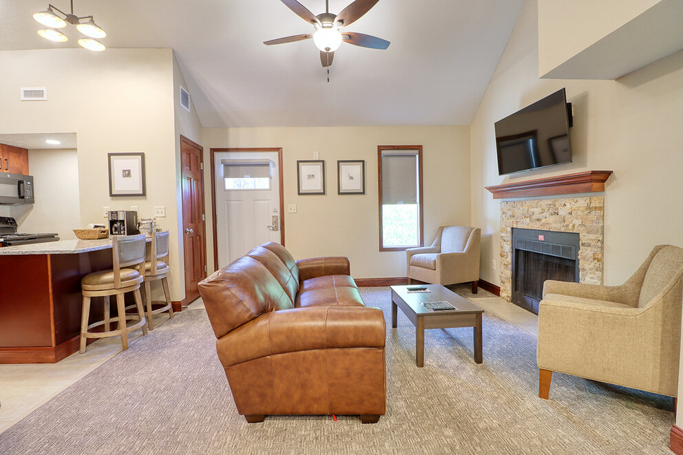 a living room with a couch and a fireplace