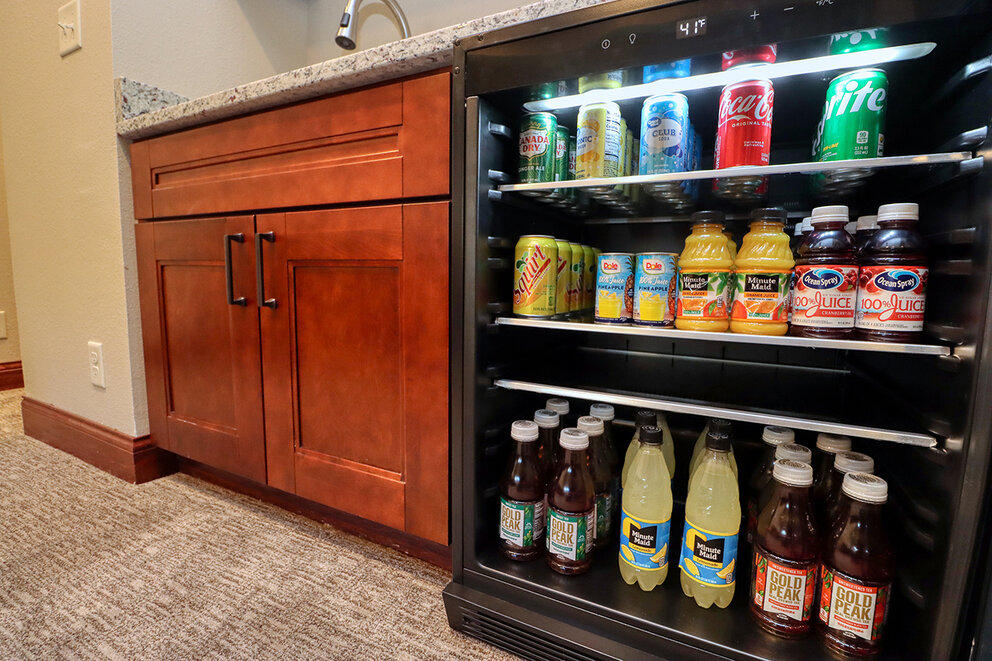a refrigerator with drinks on shelves