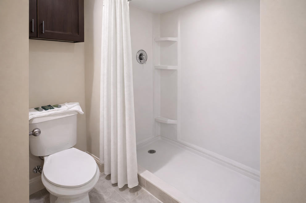 a bathroom with a shower and toilet