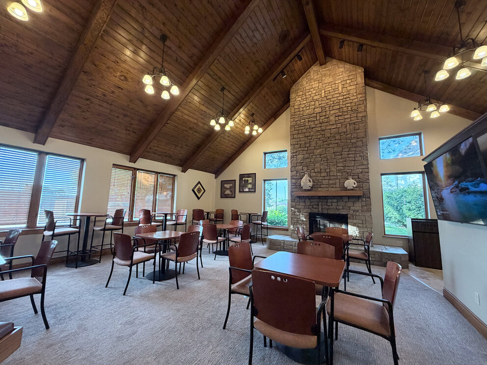 a room with tables and chairs